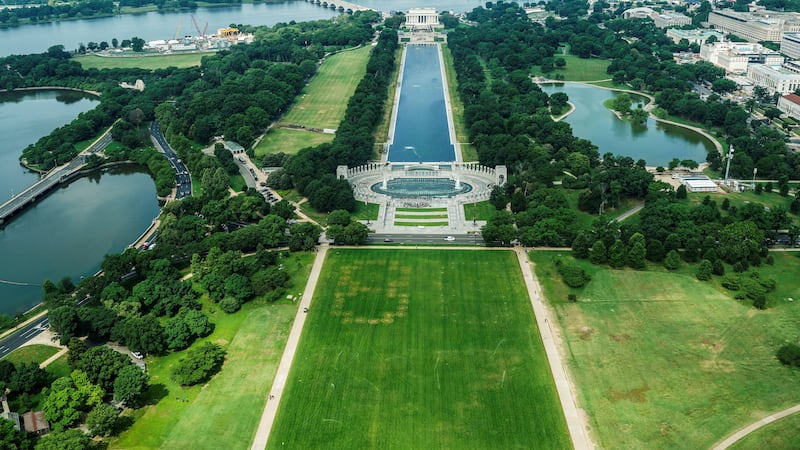 Authorities responded to what appeared to be a large tracing of the term 8647 into the grounds of the National Mall in Washington, D.C., June 11, 2026. A Reuters photographer captured the emerging image from atop the Washington Monument on the Mall's grass shortly before authorities arrived. The arrangement of the numbers was clearly an attempt to show 8647, though the 4 was not fully formed. Federal prosecutors on other occasions have said the term could indicate a threat to President Trump, the 47th U.S. president. REUTERS/Nathan Howard REFILE - QUALITY REPEAT     TPX IMAGES OF THE DAY