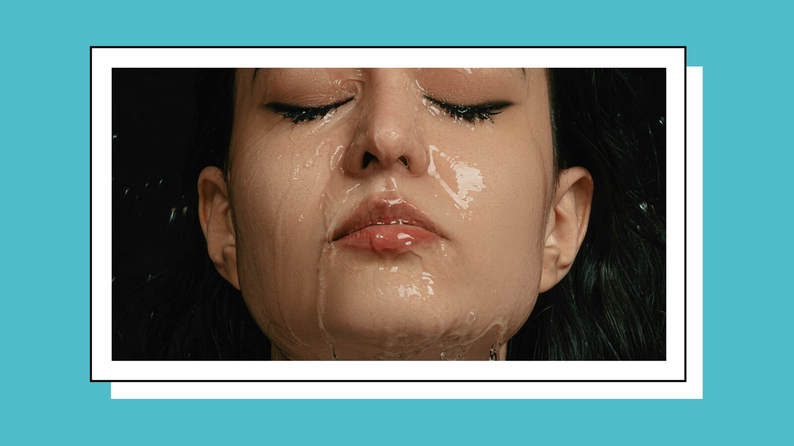 A woman with water running down her face.