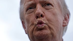 Donald Trump puckering his lips.