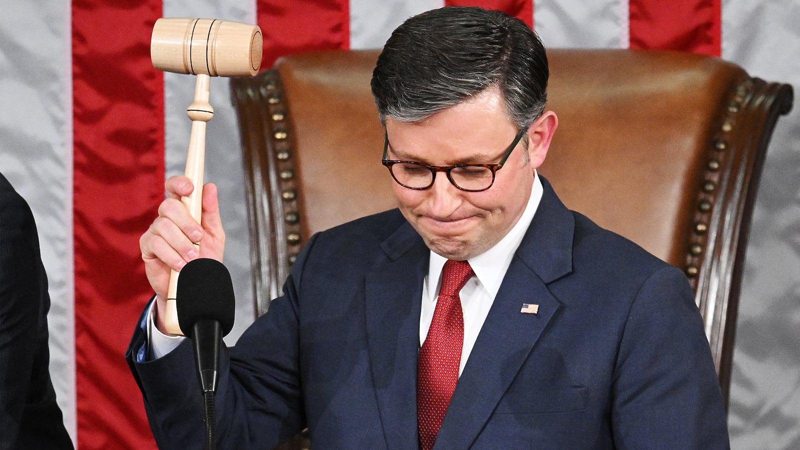 TOPSHOT - US Speaker of the House Mike Johnson, Republican from Louisiana, holds up the gavel after he won the vote for Speaker of the House, during the first day of the 119th Congress in the House Chamber at the US Capitol in Washington, DC, on January 3, 2025. (Photo by Mandel NGAN / AFP) (Photo by MANDEL NGAN/AFP via Getty Images)