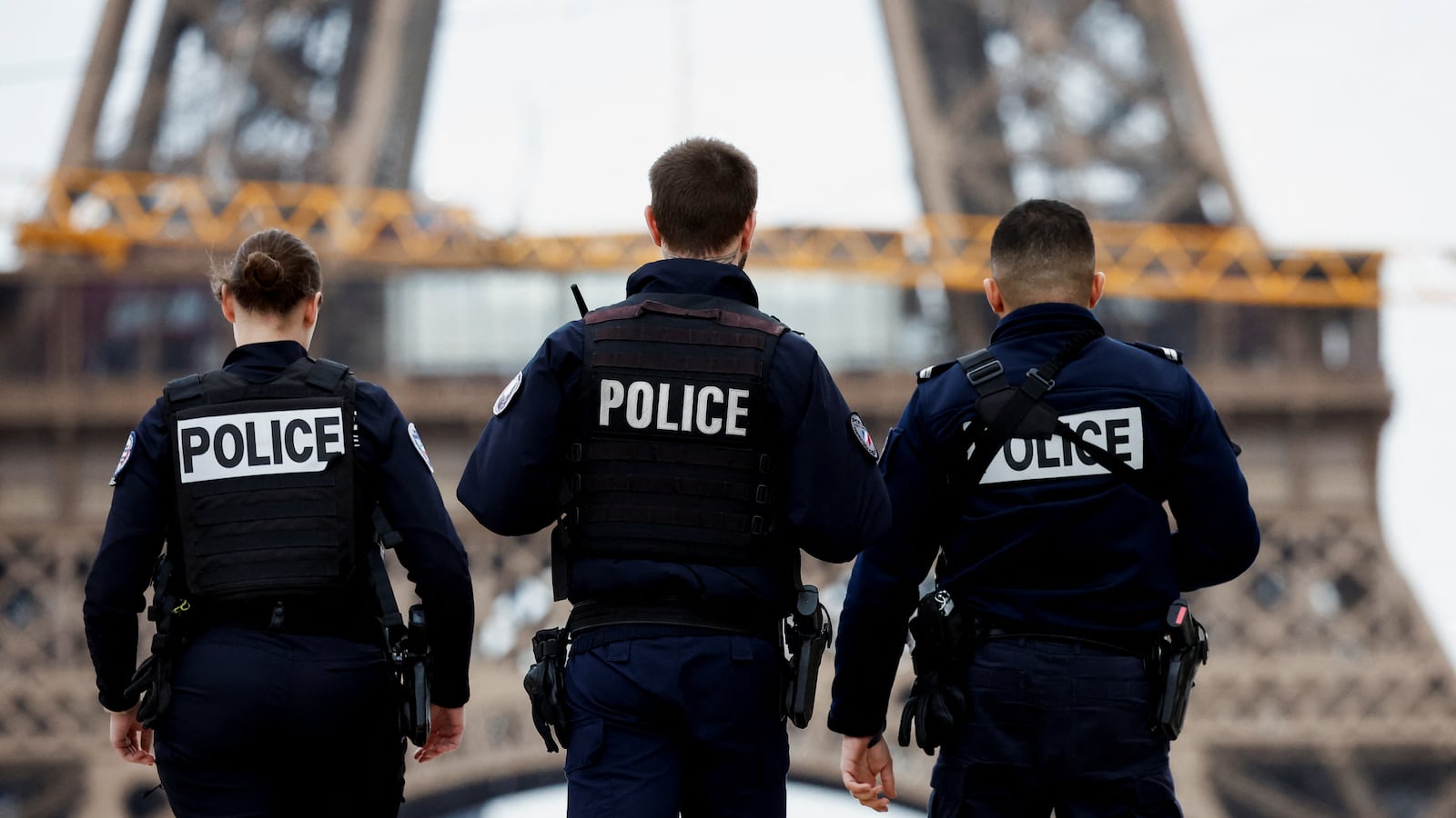 Police officers patrol on the Trocadéro square near the Eiffel Tower as part of the \"Vigipirate\" security plan as France raises terror alert warning to the highest level, after the Moscow attack, in Paris, France on March 25, 2024.