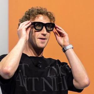 25 September 2024, USA, Menlo Park: At the Meta Connect developer conference, Mark Zuckerberg, head of the Facebook group Meta, shows the prototype of computer glasses that can display digital objects in transparent lenses. Photo: Andrej Sokolow/dpa