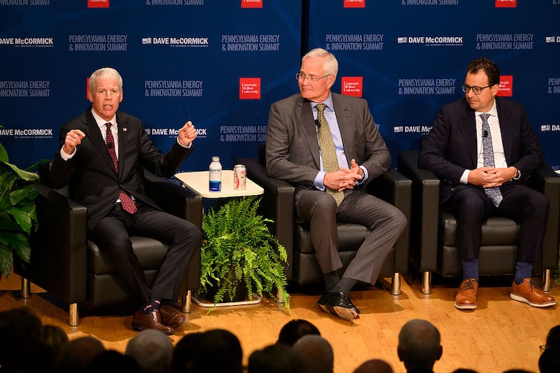 U.S. Secretary of Energy Chris Wright, Darren Woods, CEO of ExxonMobil, and Dario Amodei, CEO of Anthropic.