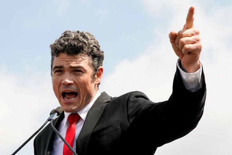 Joe Kent, who is running for Washington's 3rd congressional district, delivers a speech during a rally in support of defendants being prosecuted in the January 6 attack on the Capitol, in Washington, U.S., September 18, 2021.