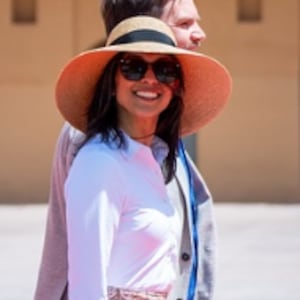 Usha Vance with a hat on.