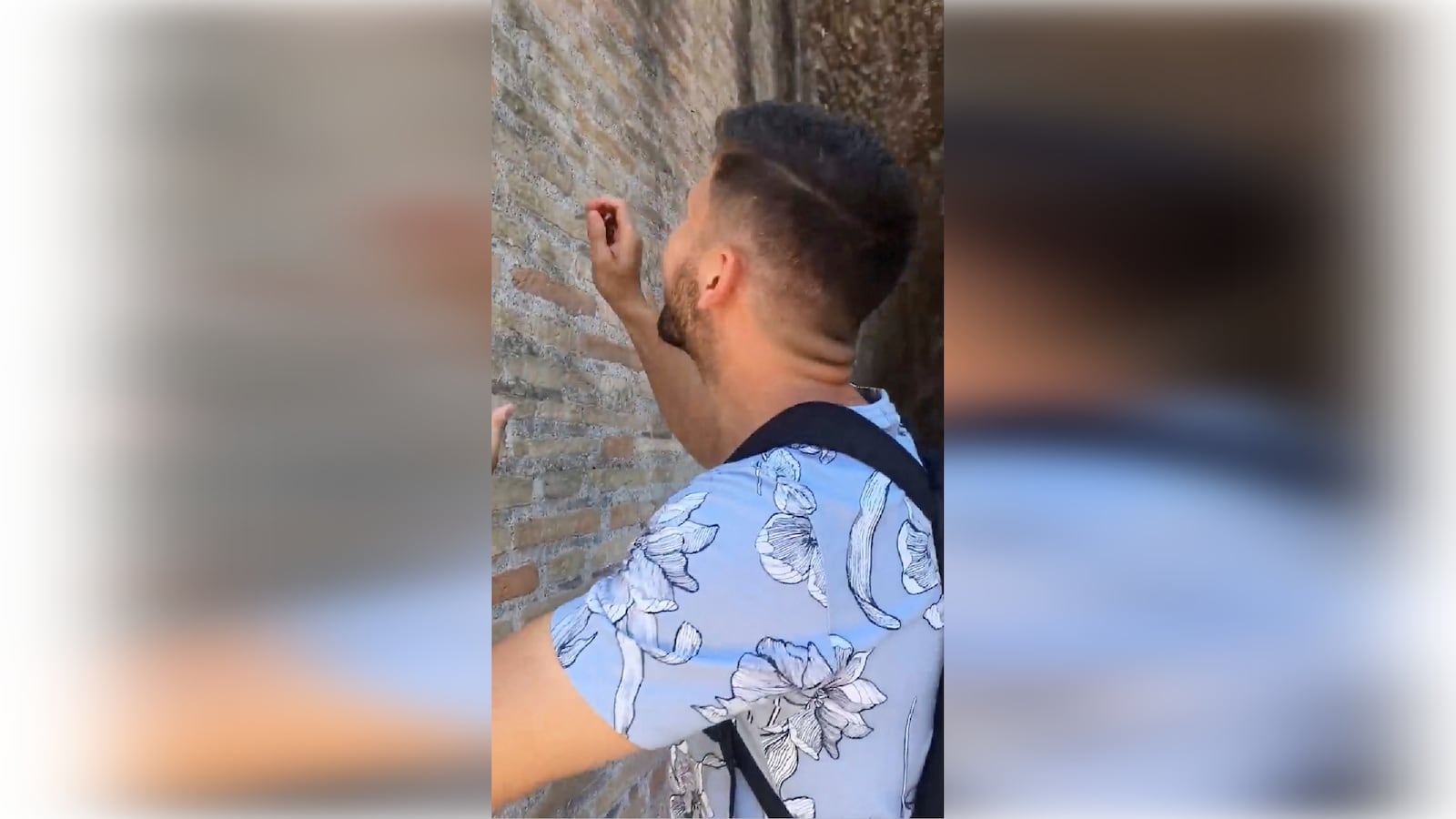 An English-speaking tourist in Rome carves the names Ivan and Hayley into the Colosseum.