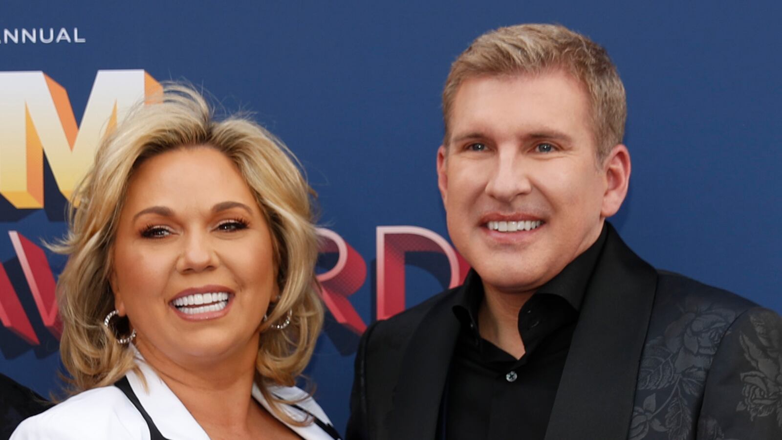 Todd and Julie Chrisley smiling before an event.