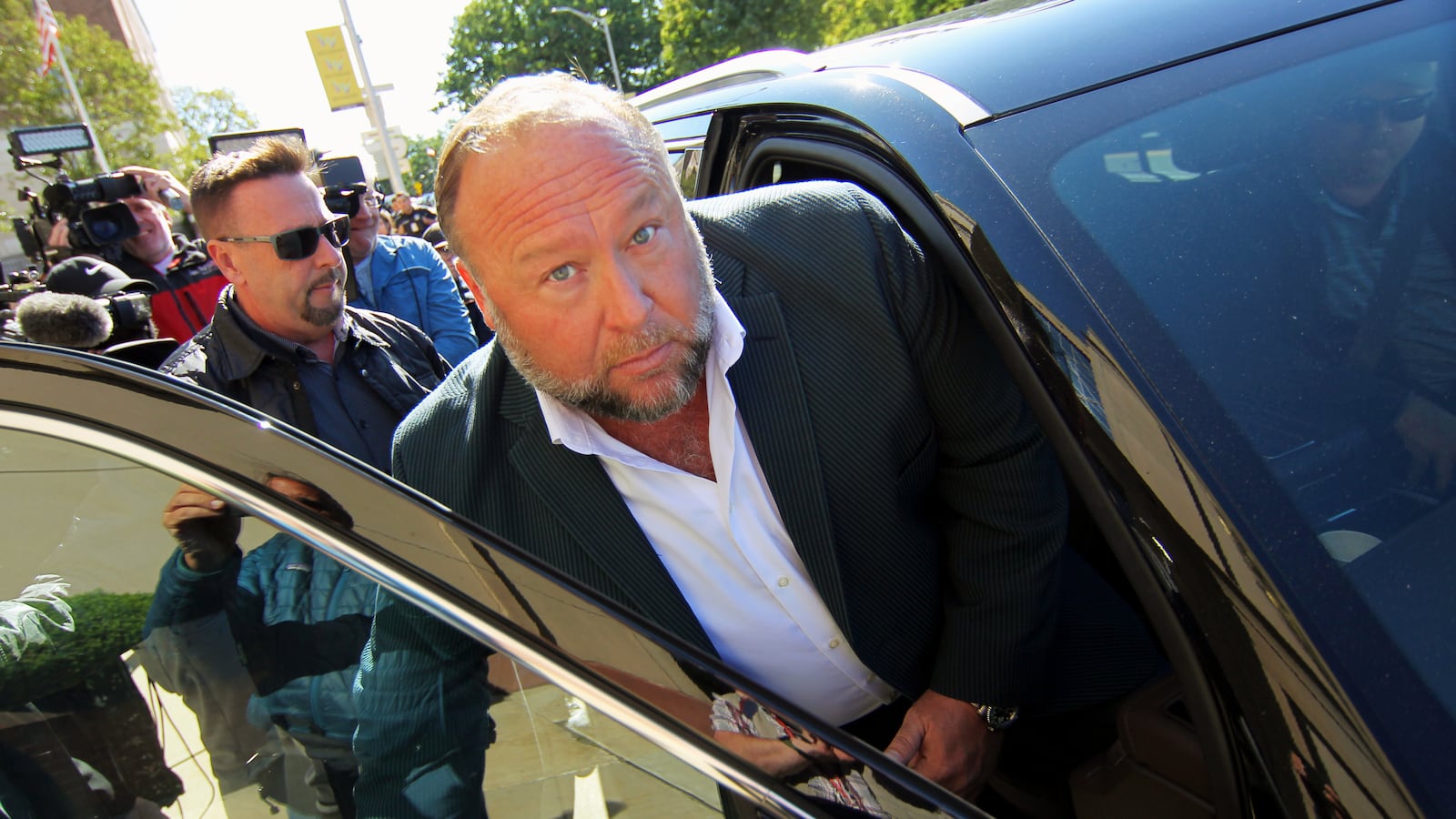 nfowars host Alex Jones leaves after speaking to the media outside Connecticut Superior Court during the ongoing Sandy Hook defamation damages trial.