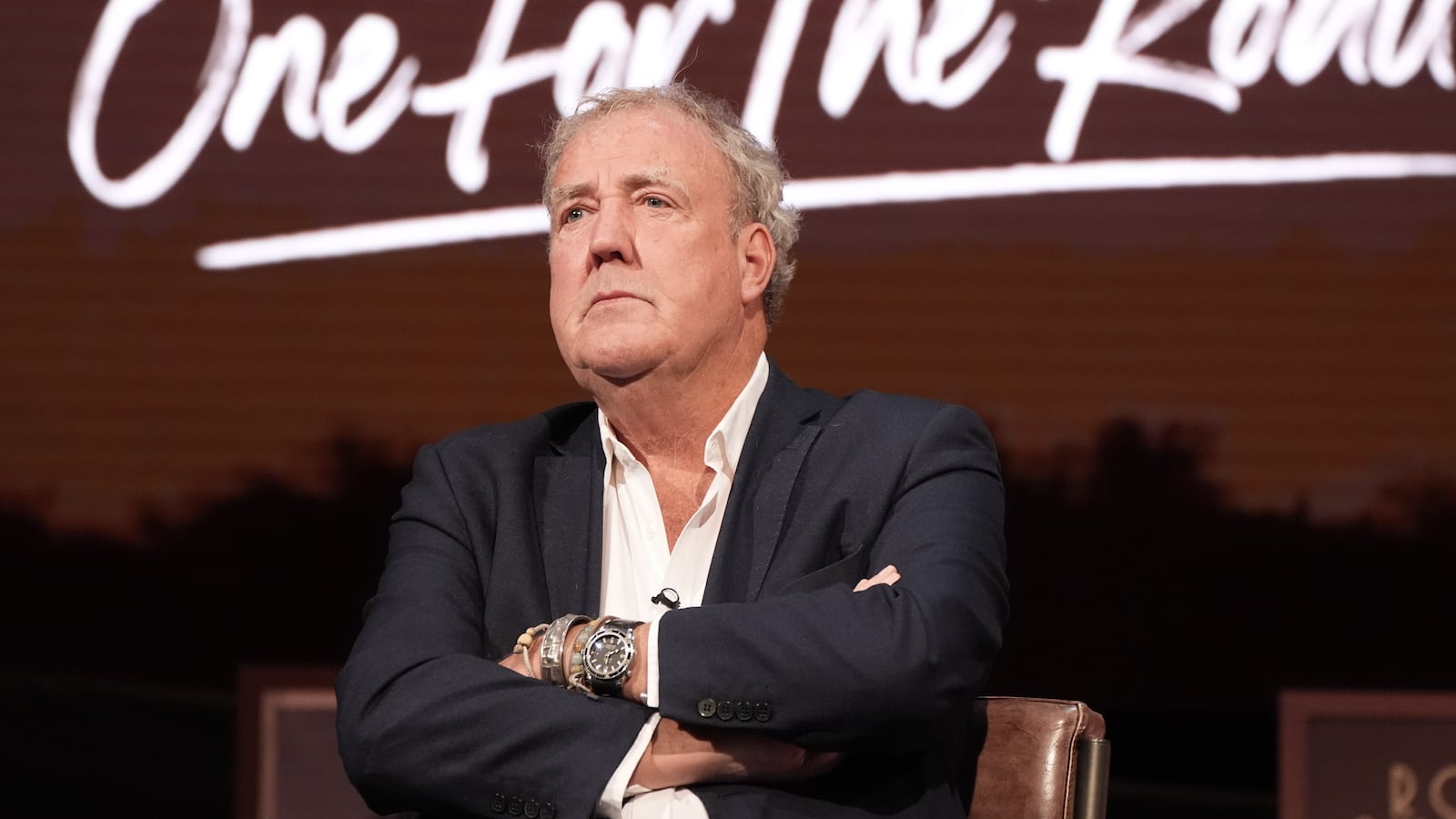 Jeremy Clarkson sitting during an event for "The Grand Tour."