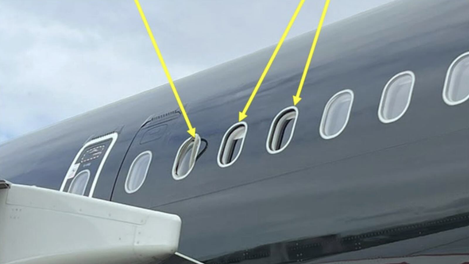Damaged windowpanes highlighted on an aircraft that was forced to turn back to the U.K. on a flight to the U.S.