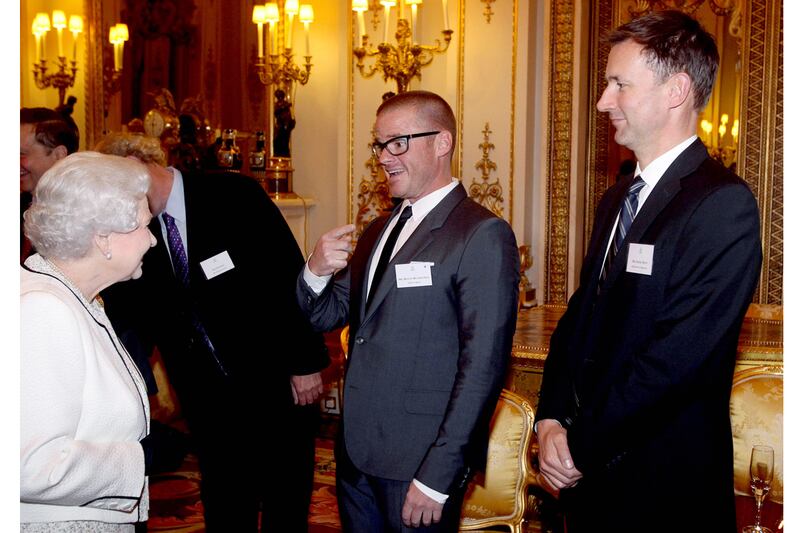 articles/2012/10/17/jeremy-hunt-jokes-with-queen-queen-doesn-t-laugh/sykes-hunt-queen-slug_jxd8g8