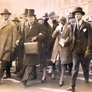 Winston Churchill, Chancellor of the Exchequer, carries the dispatch box on his way to the House of Commons, in London, to present the budget on April 29, 1929.