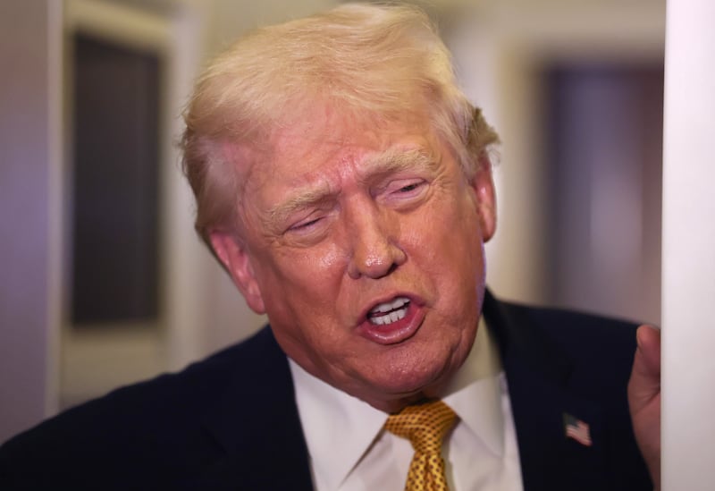 President Donald Trump speaks to the media aboard Air Force One en route to Washington, DC on January 04, 2026.