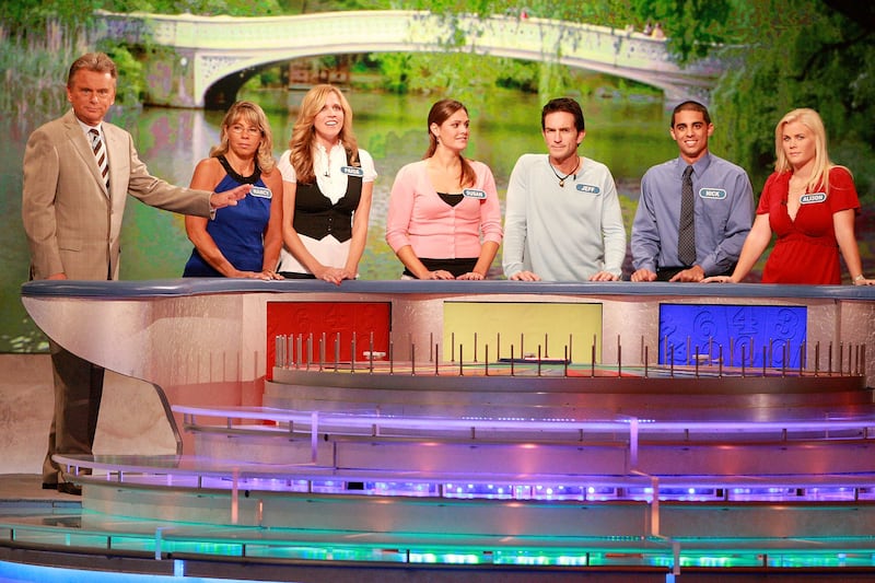 (L-R) Host Pat Sajak greets Nancy Kaufman, actress Paige Hemmis, Susan Moran, actor Jeff Probst, Nick Giovine and actress Alison Sweeney during a taping of "Wheel Of Fortune Celebrity Week" celebrating the television game show's 25th anniversary at Radio City Music Hall on September 29, 2007 in New York City.