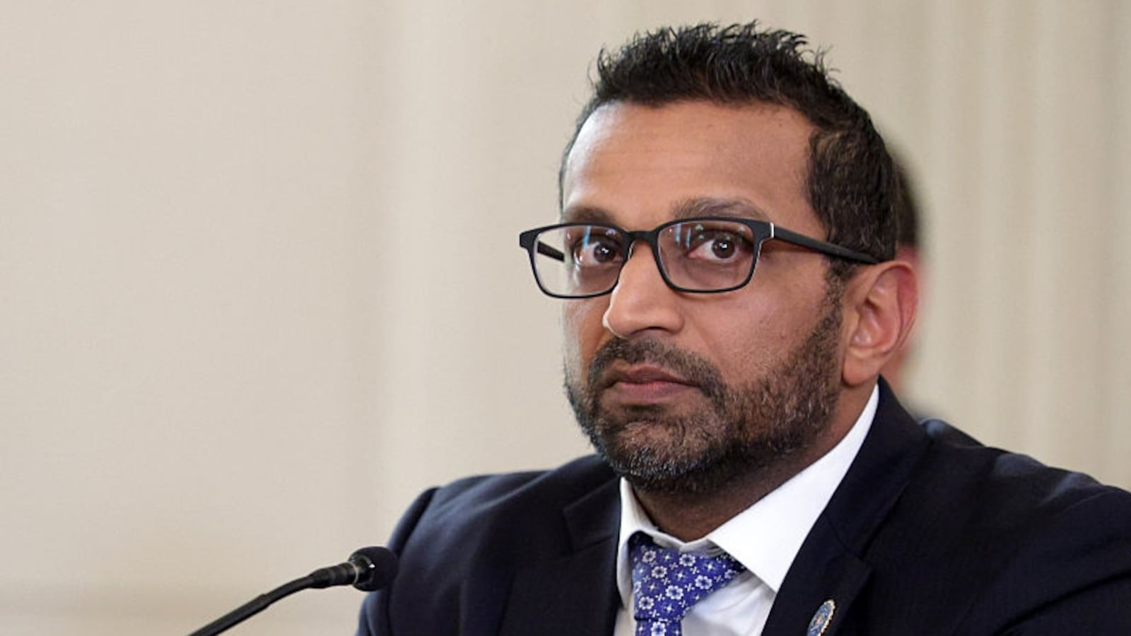 Director of the Federal Bureau of Investigation (FBI) Kash Patel listens as U.S. President Donald Trump delivers an announcement on his Homeland Security Task Force in the State Dining Room of the White House on October 23, 2025 in Washington, DC.