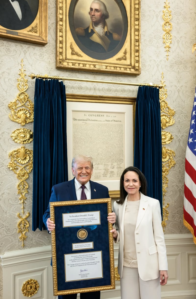 Venezuelan opposition leader Maria Corina Machado presents Donald Trump with her Nobel Peace Prize.