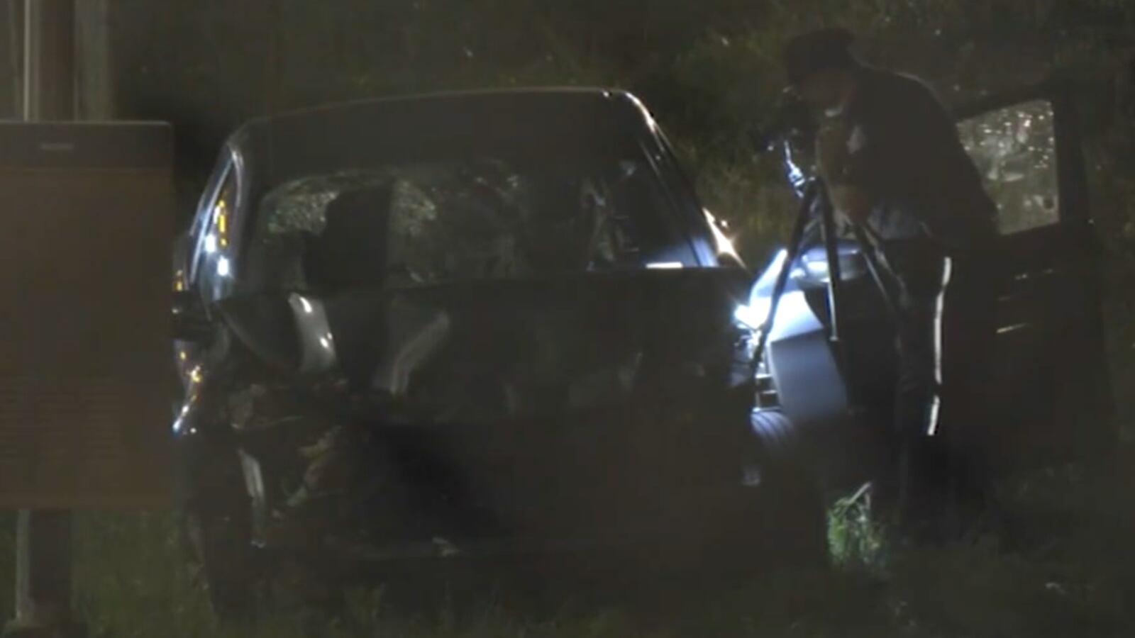 Police inspect a car involved in a crash after hitting a group of pedestrians in Midtown Manhattan.