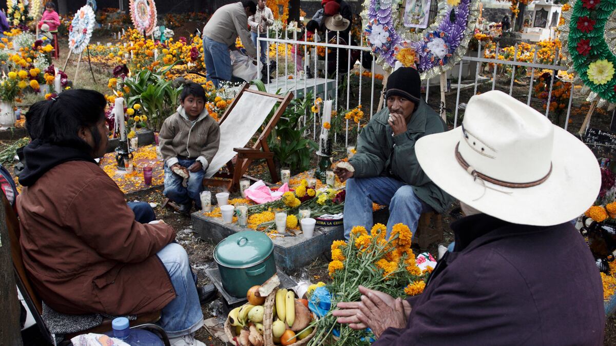 articles/2012/11/02/as-drug-war-continues-mexico-celebrates-its-deceased/day-of-dead-michoacan-puente_zcztqo