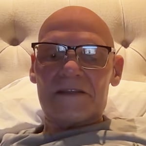 James Carville records his podcast from bed.
