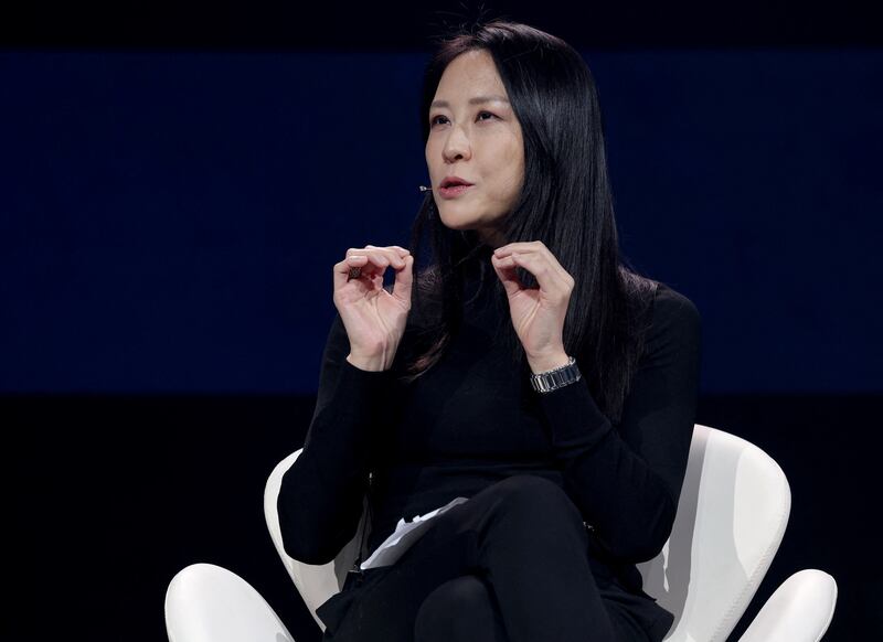Chinese economist and author Keyu Jin gestures as she speaks on stage at the MWC (Mobile World Congress), the world's biggest mobile fair,