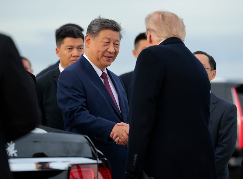U.S. President Donald Trump (R) talks with Chinese President Xi Jinping (L) during an arrival ceremony on September 23, 2026 at Joint Base Andrews, Maryland. President Trump is hosting President Xi for a three-day state visit to Washington, DC where the leaders are expected to discuss trade practices, artificial intelligence and furthering “strategic stability” between their countries.