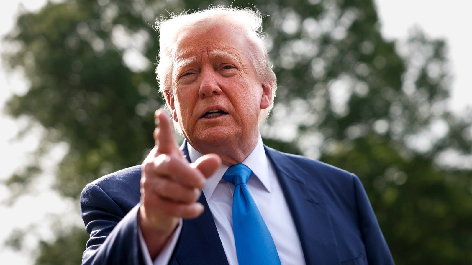 President Donald Trump speaks to the media as he departs the White House on April 25, 2025