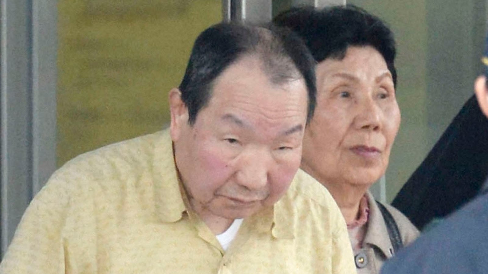 Iwao Hakamada (L), flanked by his sister Hideko, is released from Tokyo Detention House in Tokyo, in this photo taken by Kyodo, March 27, 2014.
