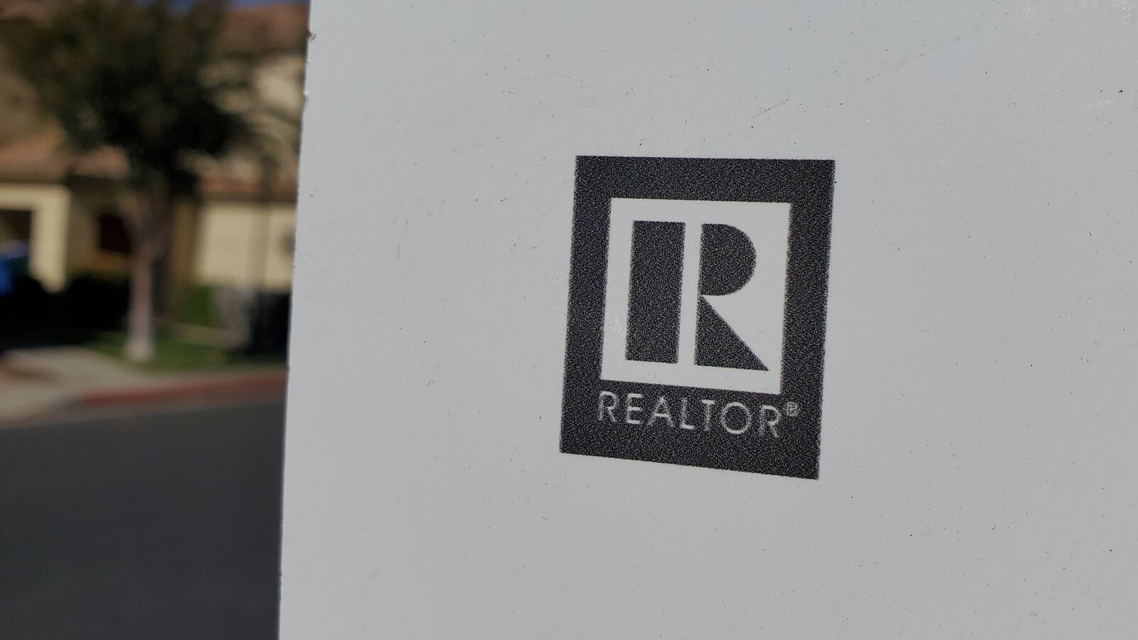 Close-up of logo for National Association of Realtors. The president of the NAR, Kenny Parcell, is facing allegations of sexual harassment.