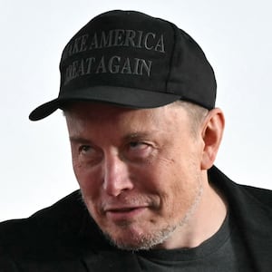Tesla CEO Elon Musk (R) joins former US President and Republican presidential candidate Donald Trump during a campaign rally at site of his first assassination attempt in Butler, Pennsylvania on October 5, 2024. (Photo by Jim WATSON / AFP) (Photo by JIM WATSON/AFP via Getty Images)