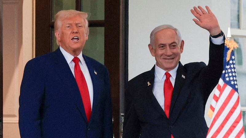 U.S. President Donald Trump speaks as Israeli Prime Minister Benjamin Netanyahu waves following a meeting in the White House, in Washington, U.S., April 7, 2025.