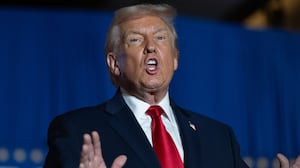US President Donald Trump sings upon his arrival to deliver remarks on the economy at Mount Airy Casino Resort in Mount Pocono, Pennsylvania, on December 9, 2025. (Photo by ANDREW CABALLERO-REYNOLDS / AFP via Getty Images)