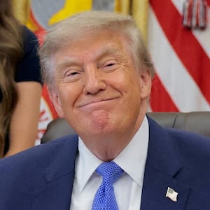 U.S. President Donald Trump attends an event to sign an executive order regarding vaccine flexibility, with Heidi Overton (not pictured), Dr. Jay Bhattacharya, Director of the National Institutes of Health, and Secretary of Health and Human Services (HHS) Robert F. Kennedy Jr., in the Oval Office at the White House in Washington, D.C., U.S., August 10, 2026.
