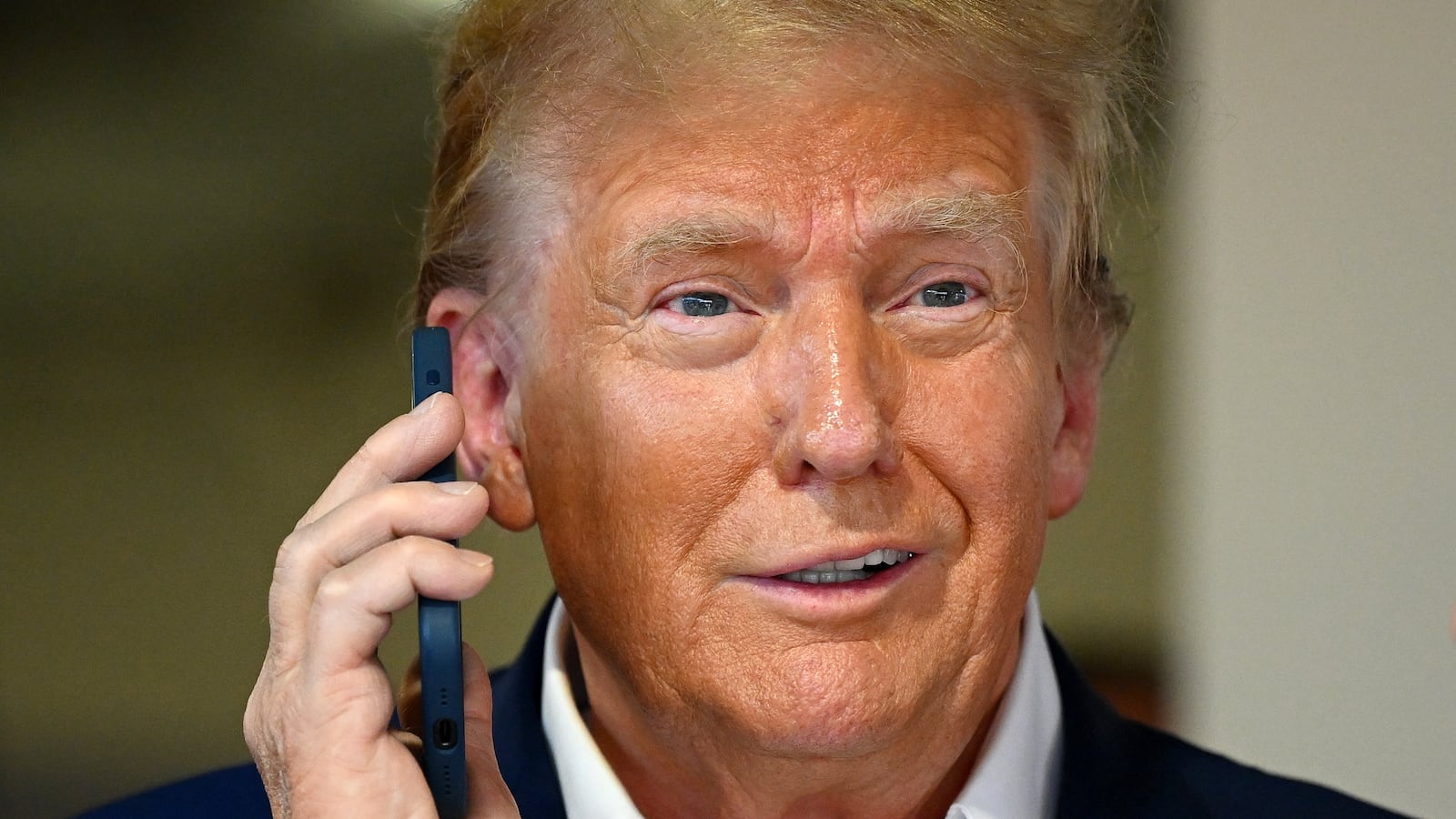 Donald Trump talks on the phone.