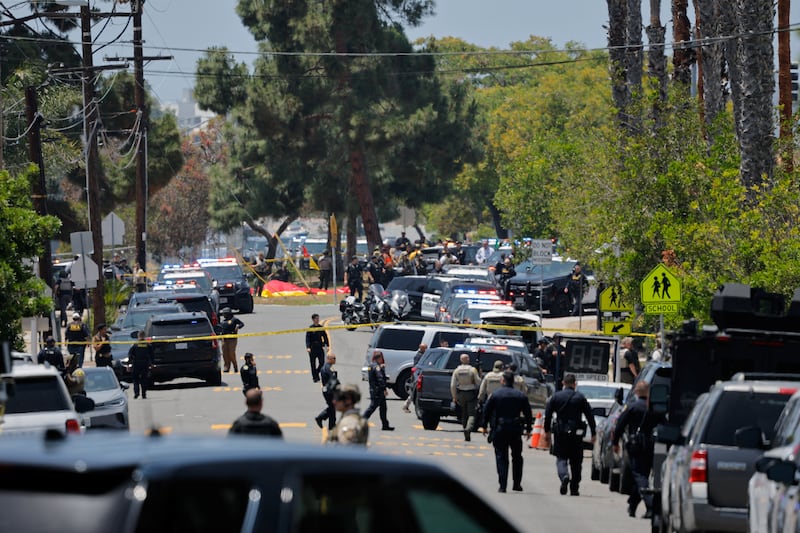 Emergency workers respond at the scene of a reported active shooter situation at the Islamic Center in San Diego
