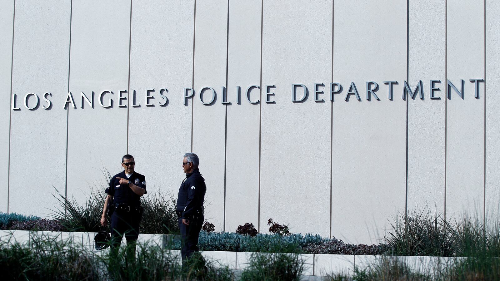 Police officers patrol outside LAPD headquarters in Los Angeles, California February 7, 2013.
