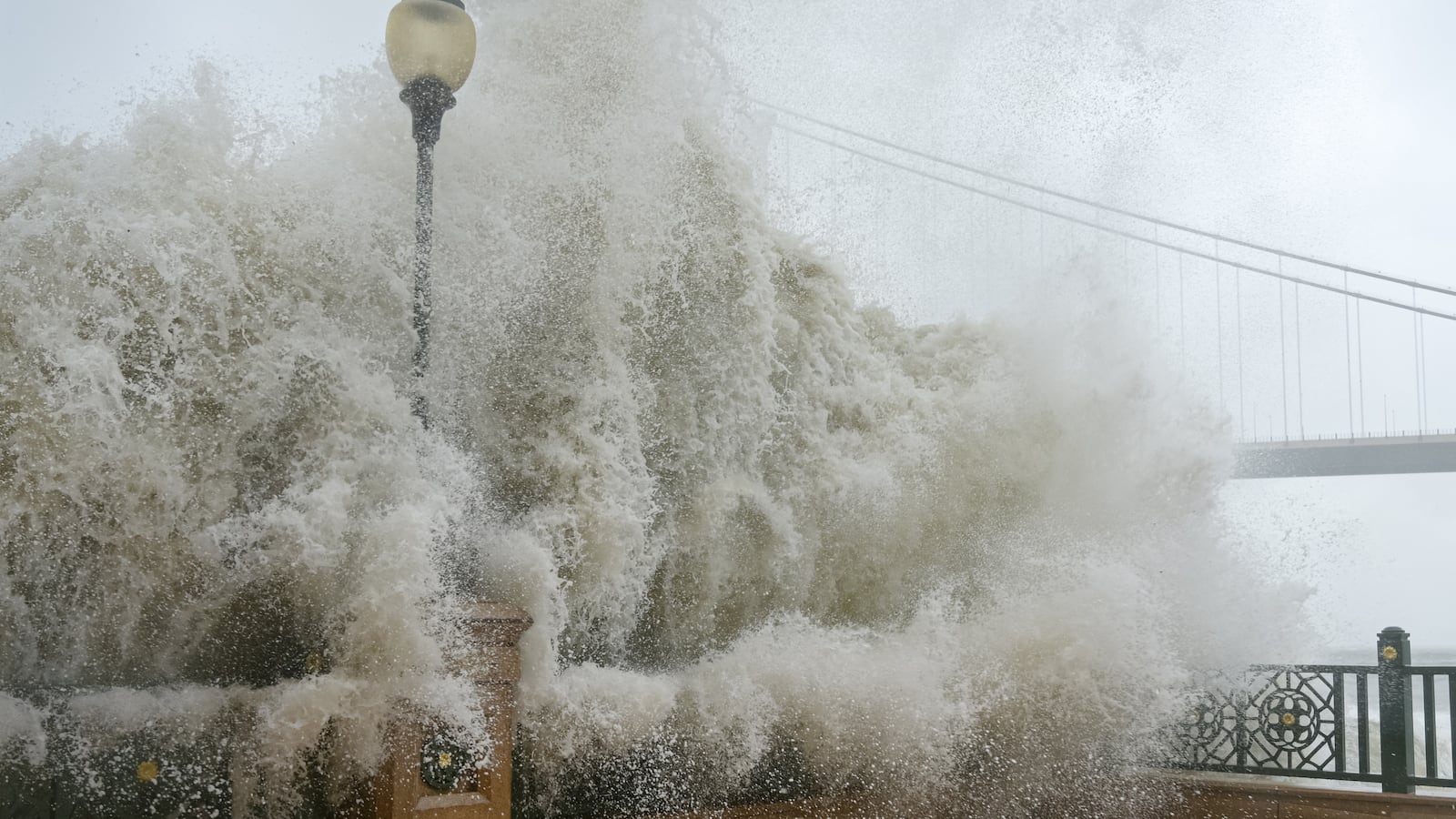 Waves crash on the pier as Typhoon Ragasa hits Hong Kong