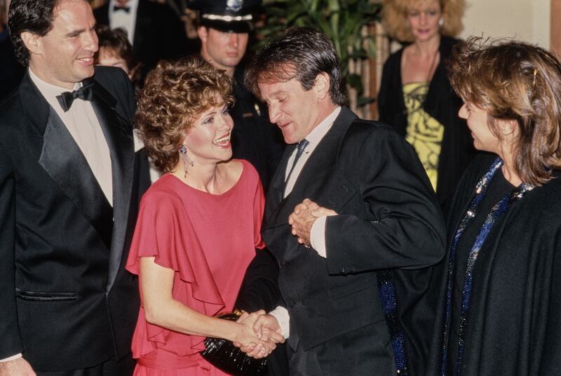 Sally Field with American comedian and actor Robin Williams at the 42nd Golden Globe Awards at the Beverly Hilton Hotel in Beverly Hills, California, 27th January 1985.