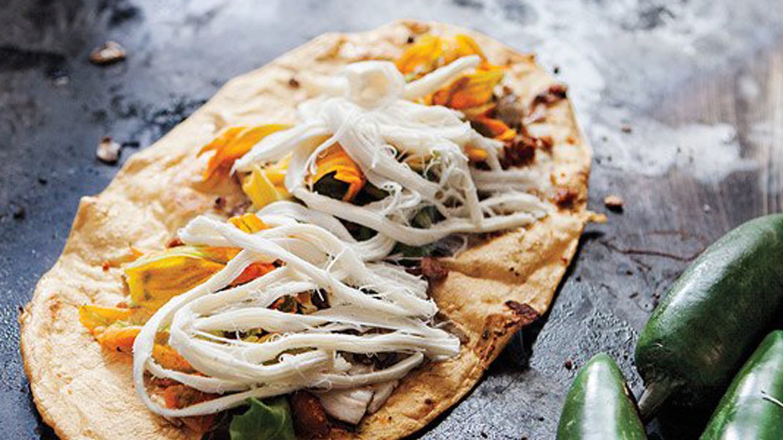 articles/2013/11/05/a-culinary-tour-to-answer-the-age-old-question-why-is-mexican-food-so-good/131104-mercado-carmen-tease_sodgw8