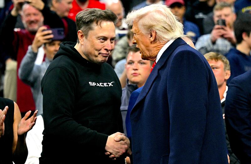 Tesla and SPaceX CEO Elon Musk and US President Donald Trump shake hands