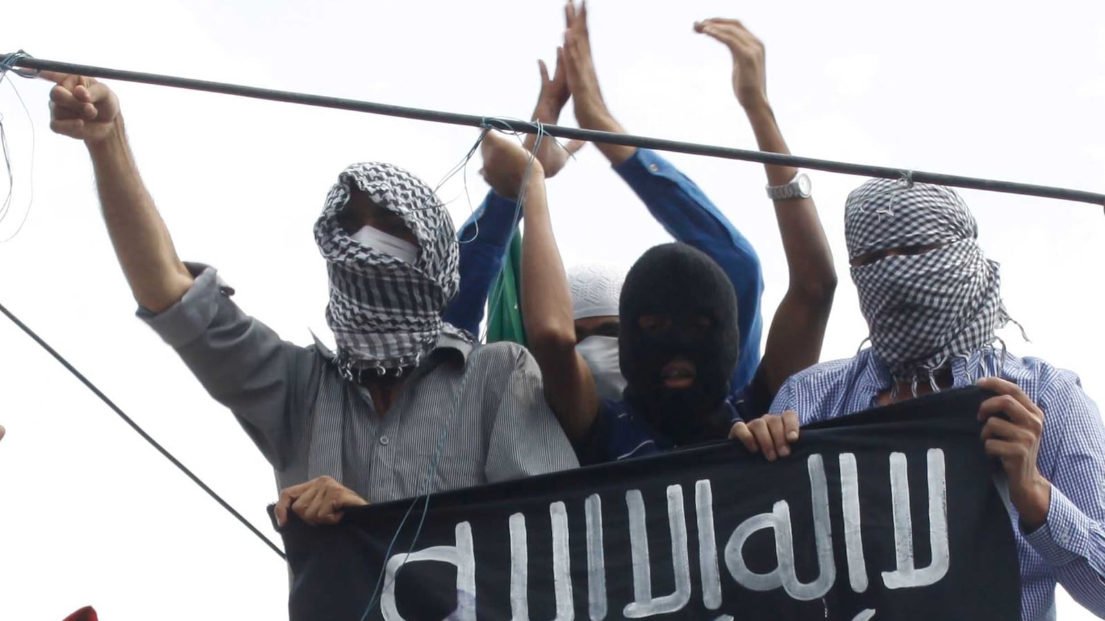 articles/2014/10/06/the-polls-are-in-isis-is-outside-your-window/141004-holmes-isis-tease_mep29t