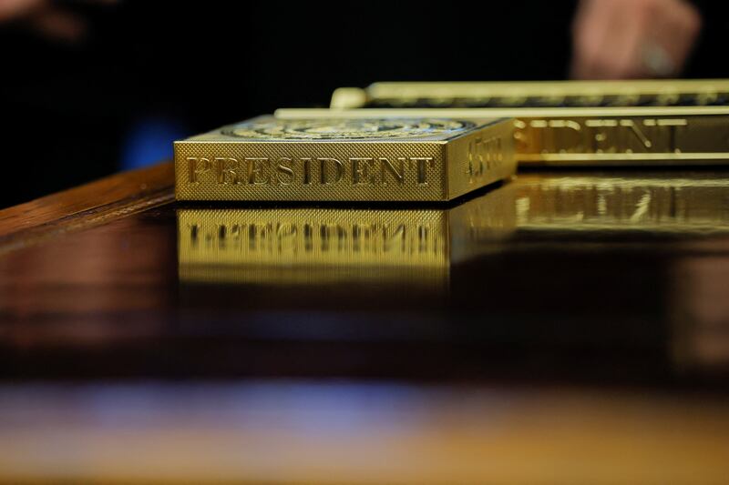 Golden coaster on Trump's desk