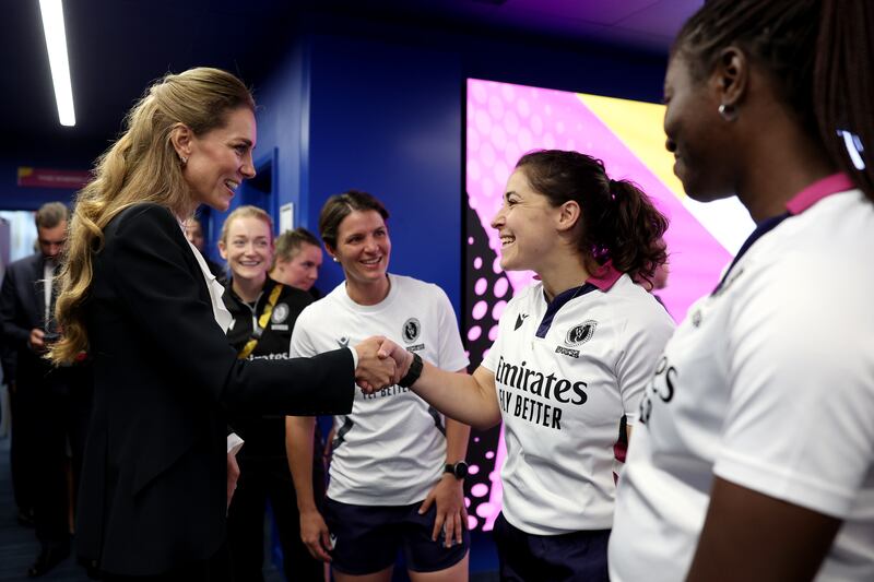 BRIGHTON, ENGLAND - SEPTEMBER 06: Catherine, Princess of Wales, shakes hands with Referee Amelia Luciano following the Women's Rugby World Cup 2025 Pool A match between England and Australia at Brighton & Hove Albion Stadium on September 06, 2025 in Brighton, England. (Photo by Alex Davidson - World Rugby/World Rugby via Getty Images)