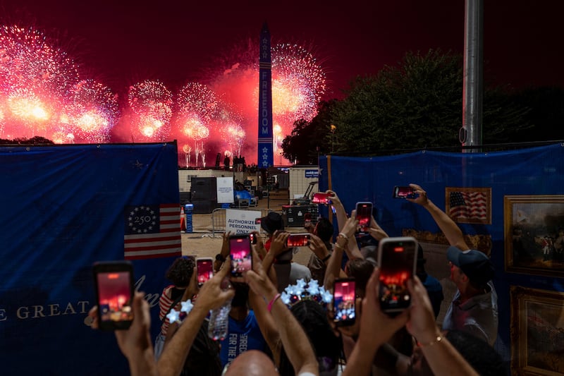 People watch a fireworks display during the Freedom 250's Salute to America as the United States celebrates its 250th anniversary on Independence Day, attempting the largest firework display in history with 850,000 fireworks in Washington, D.C., U.S., July 5, 2026. REUTERS/Cheney Orr