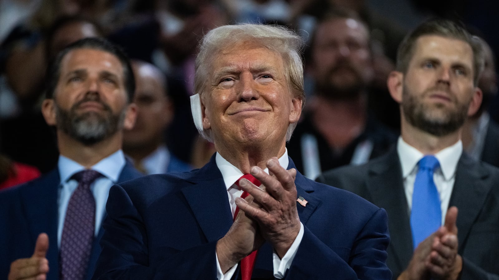 President Donald Trump is pictured with his sons Don Jr., left, and Eric, in Fiserv Forum on the first day of Republican National Convention in Milwaukee, Wis., on July 15, 2024.