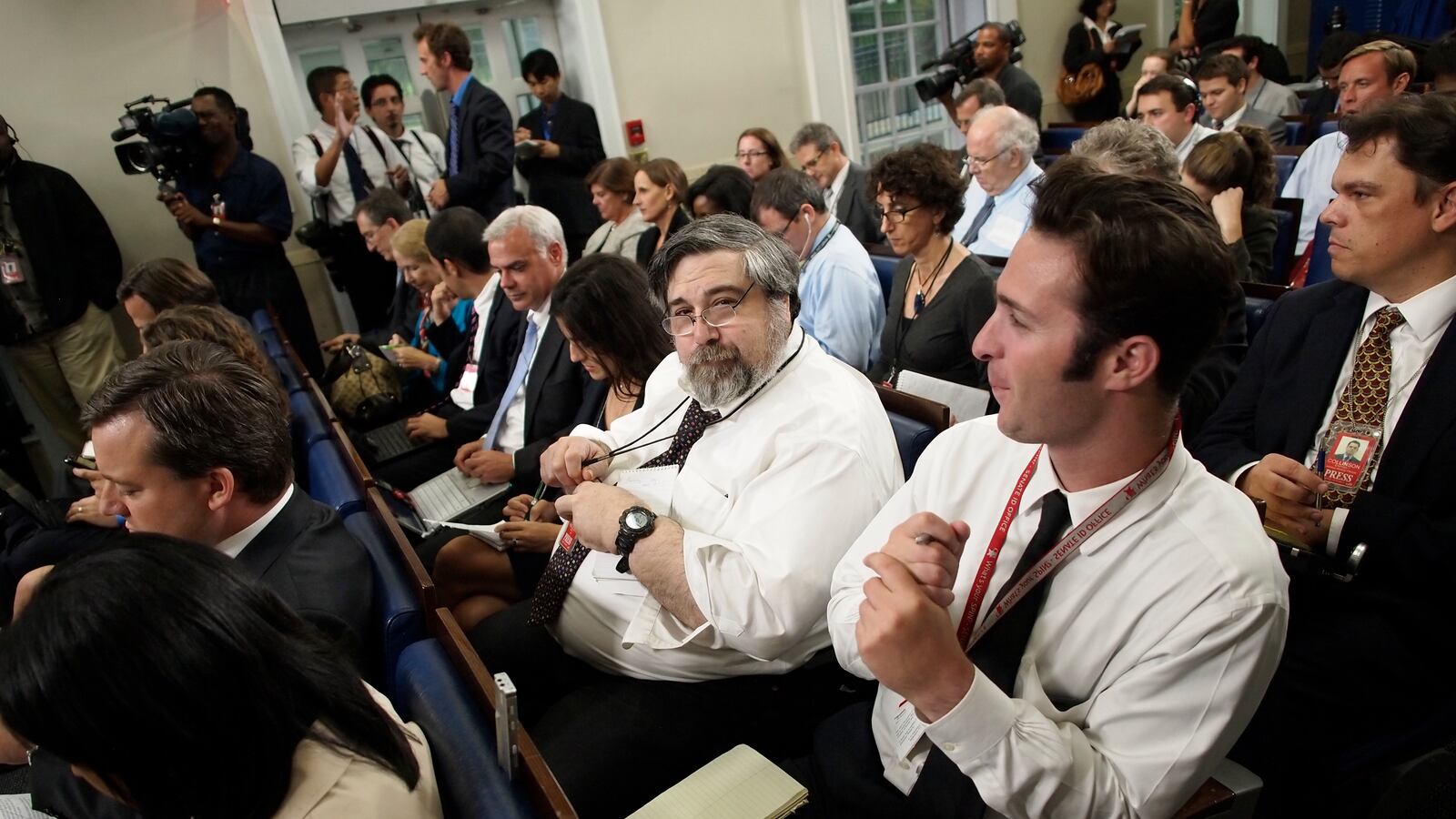 Mark Knoller of CBS News, center, waits for the start of the daily press briefing by White House Press Secretary Jay Carney at the White House in Washington, Wednesday, Sept. 7, 2011.