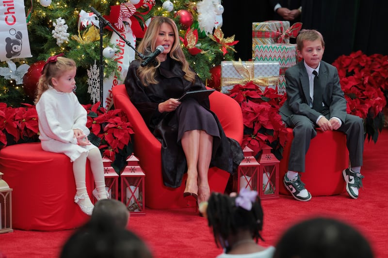 First lady Melania Trump reads a children’s books to patients and their families at Children’s National Hospital on December 5, 2025 in Washington, DC.