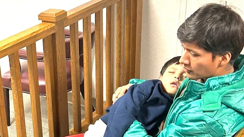 Liam Conejo Ramos lies unresponsive in his father's arms in ICE detention during the visit by Reps. Jasmine Crockett and Joaquin Castro.