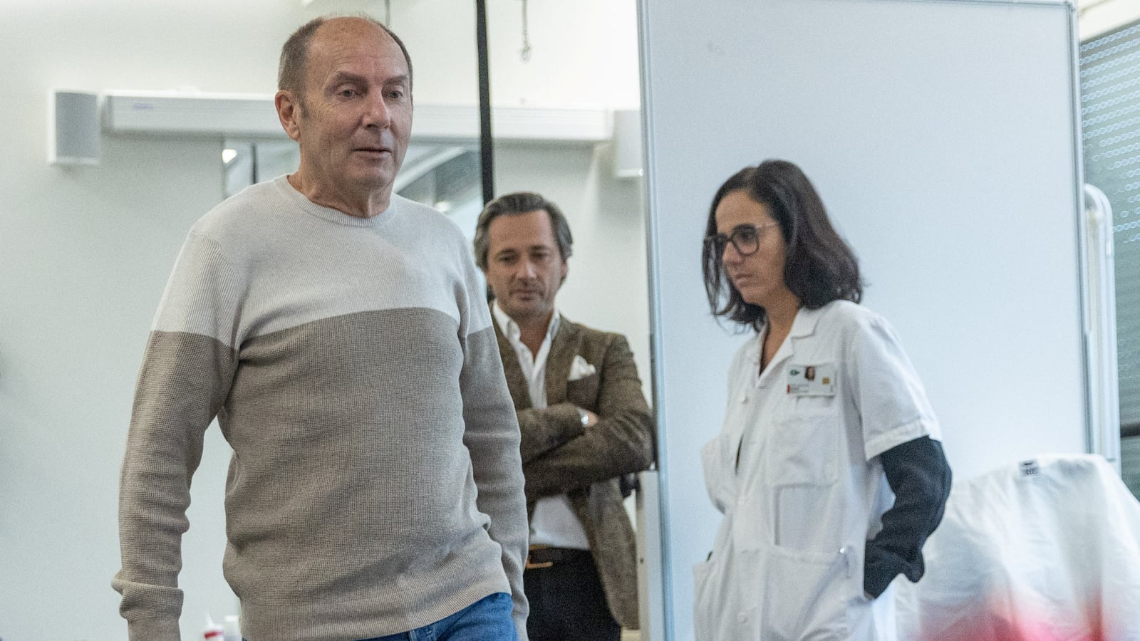 Marc Gauthier walks with his new spinal cord implant.