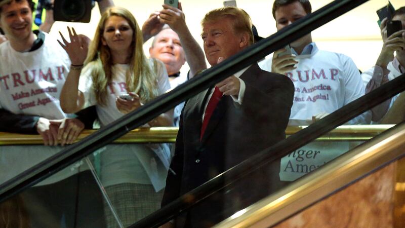 Donald Trump arrives by escalator inside at Trump Tower to announce
 his campaign for the 2016 Republican presidential nomination