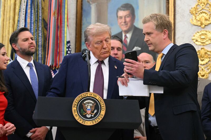 Fox News reporter Peter Doocy showed President Donald Trump something on a phone in the Oval Office on Tuesday.
